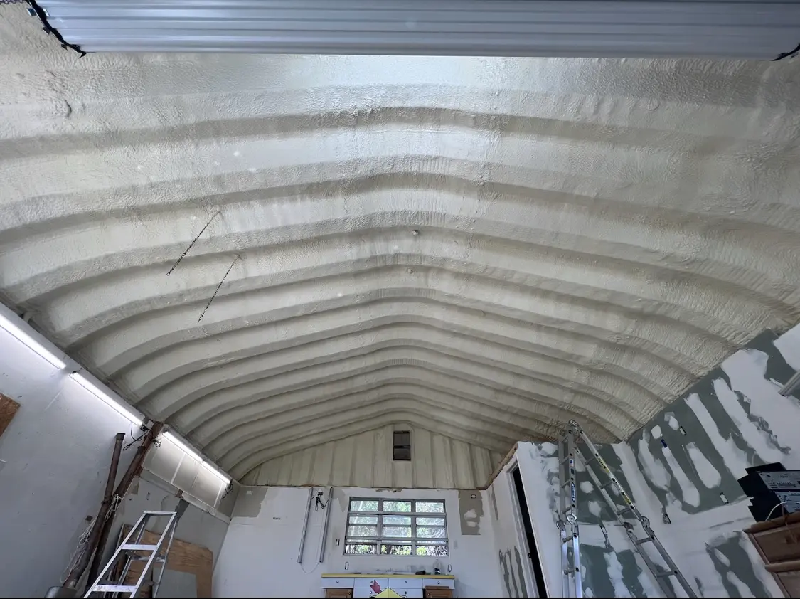 Spray polyurethane foam applied to the underside of a metal roof deck in Vidalia